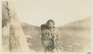 Image of Eskimo [Inughuit] girl tending baby